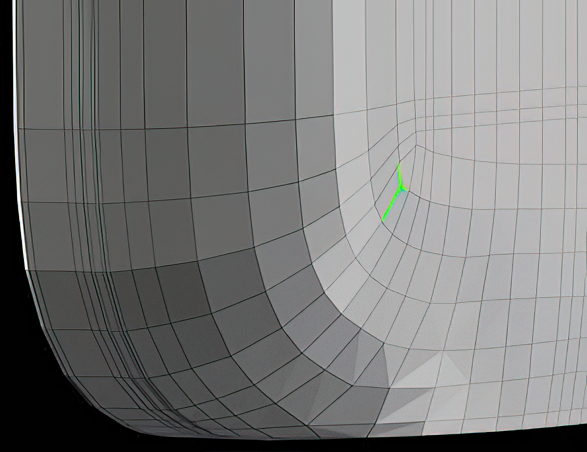Close-up of a curved surface showing a single T-vertex highlighted in green where three edges meet